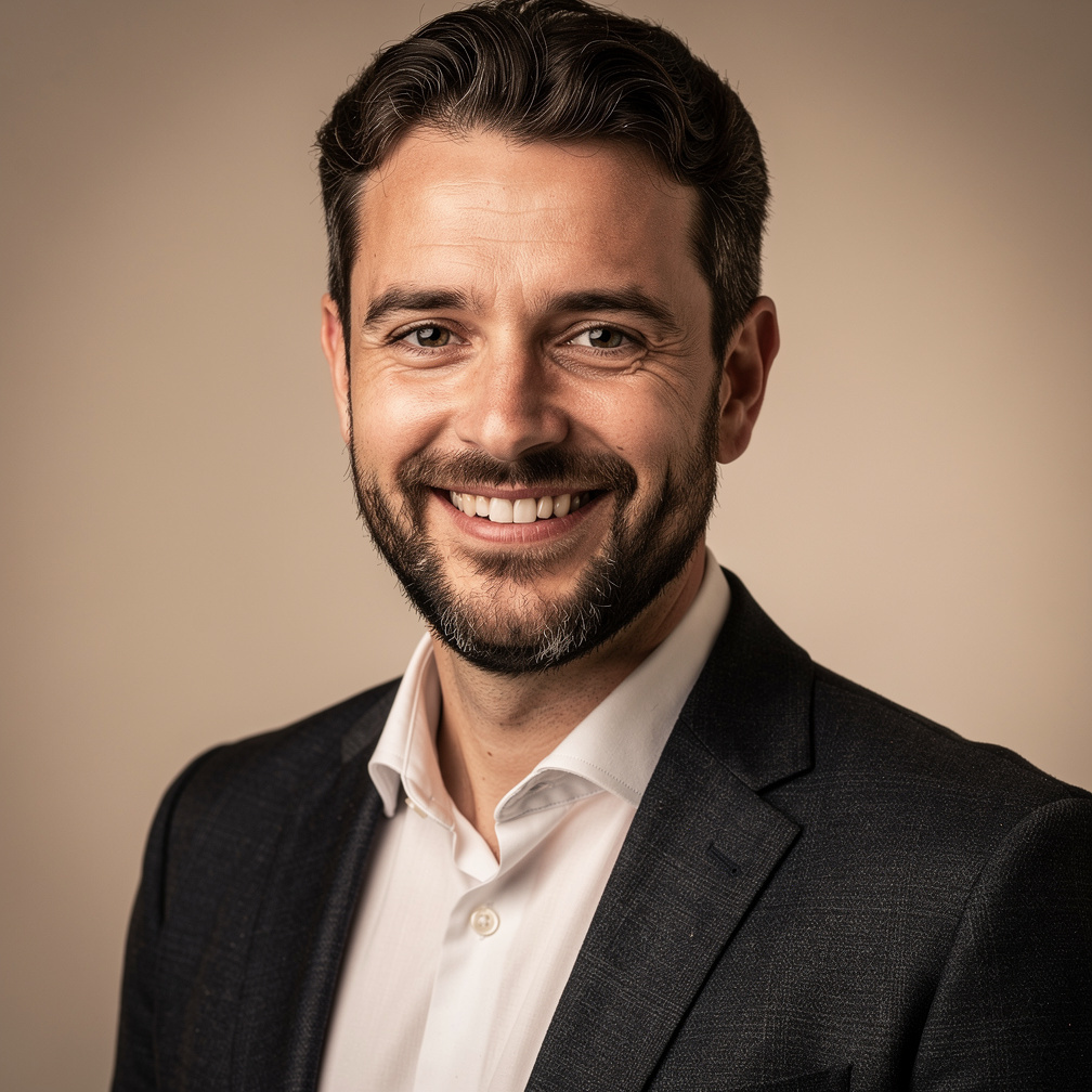 Studio portrait of a Belgian man with a beard in business attire