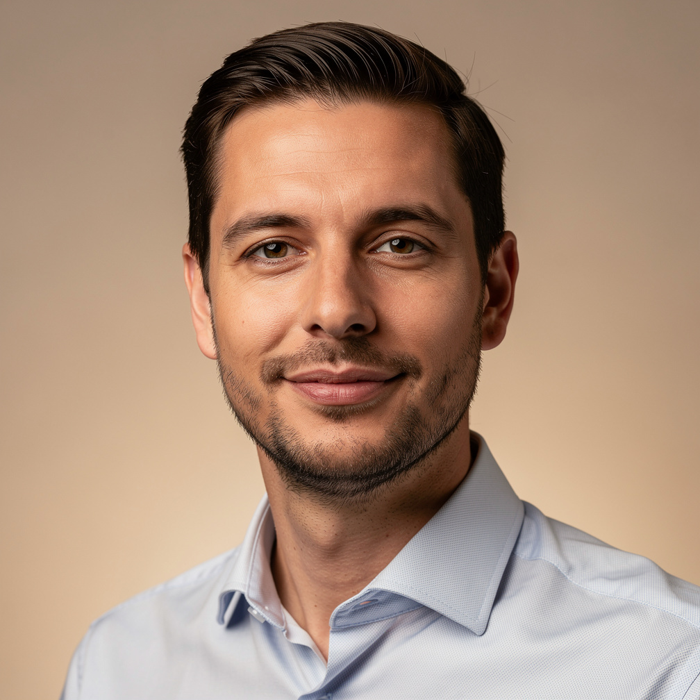 Studio portrait of a Belgian man with short hair and stubble